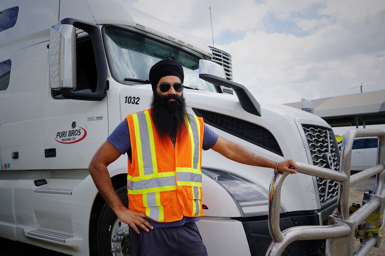 Truck driver reviewing paperwork in the cab